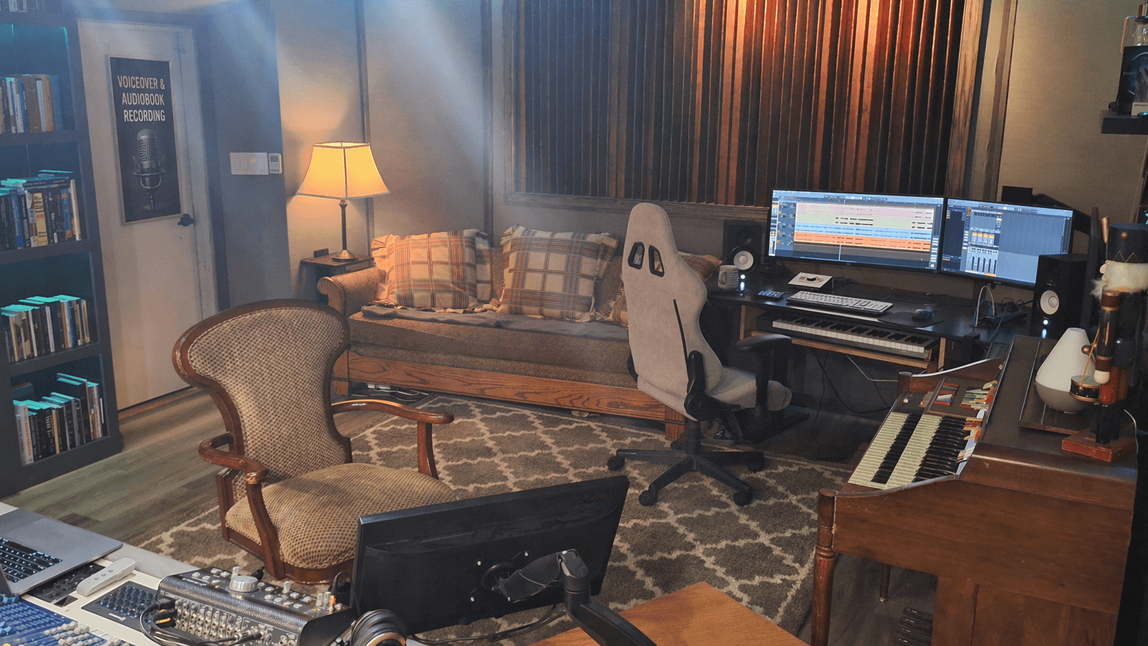 Production desk with dual monitors, studio monitors, and MIDI keyboard