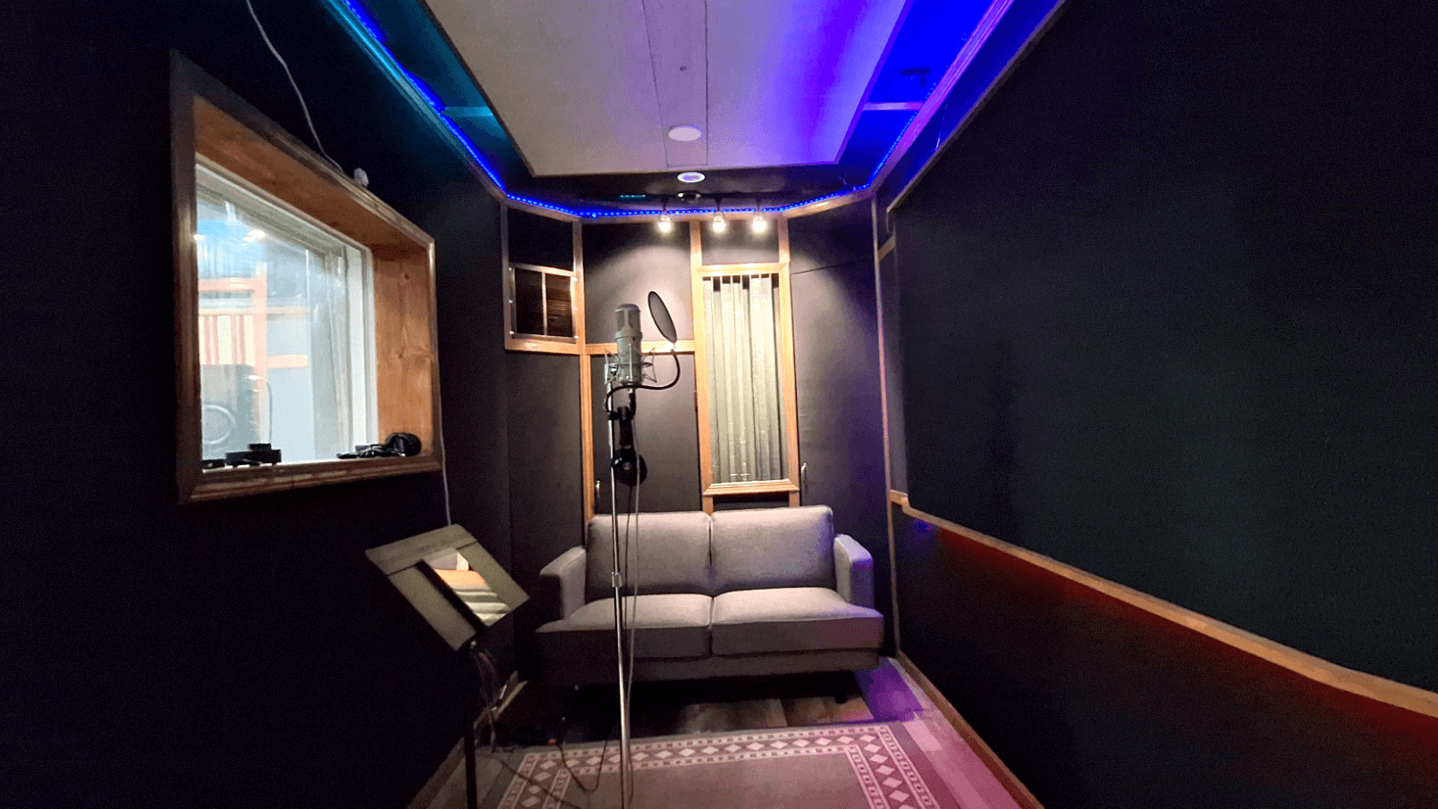 Vocal booth with warm lighting for an intimate, creative tracking environment