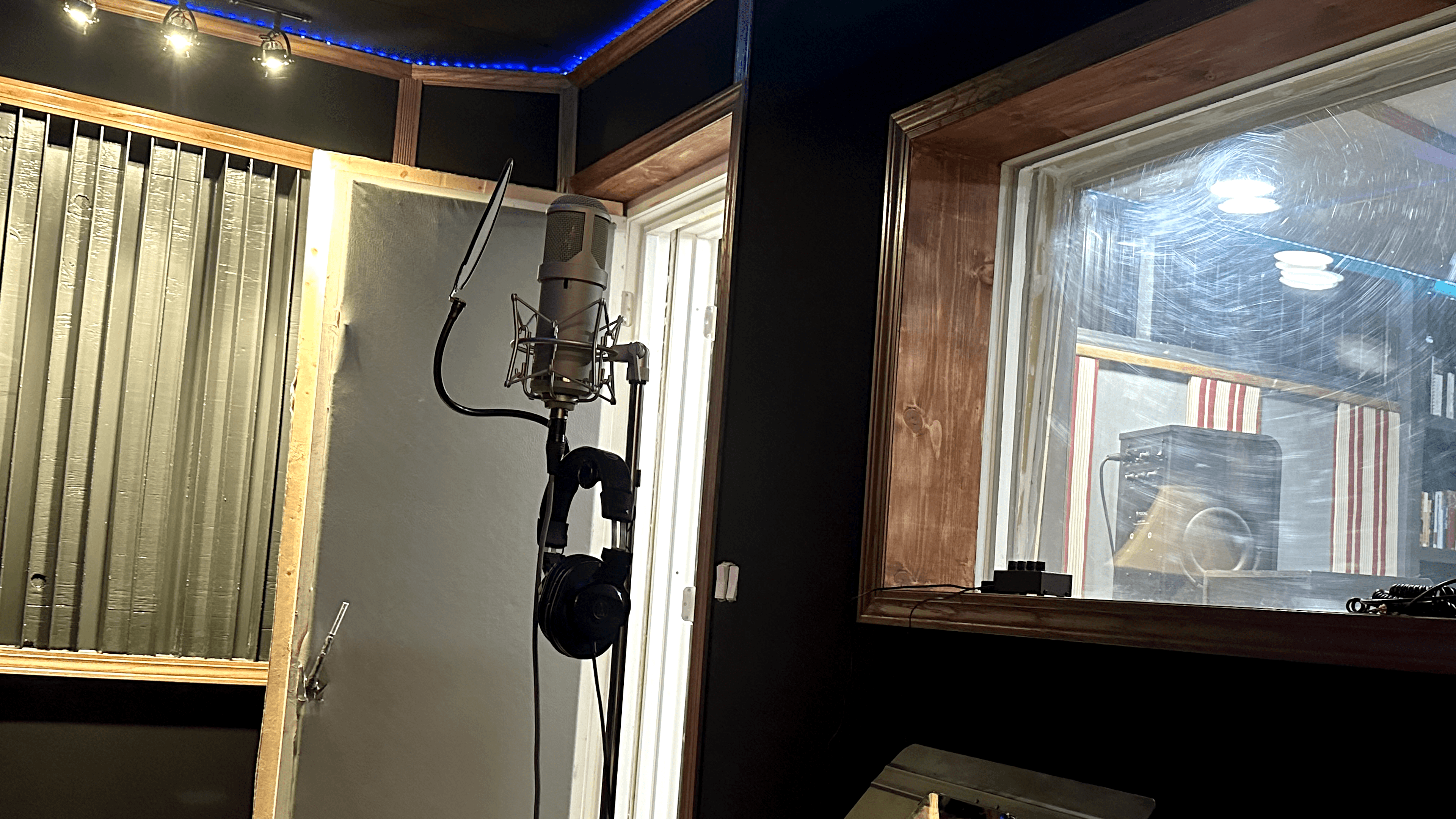 Lead vocal position at the mic with headphones, pop filter, and a dialed-in cue mix